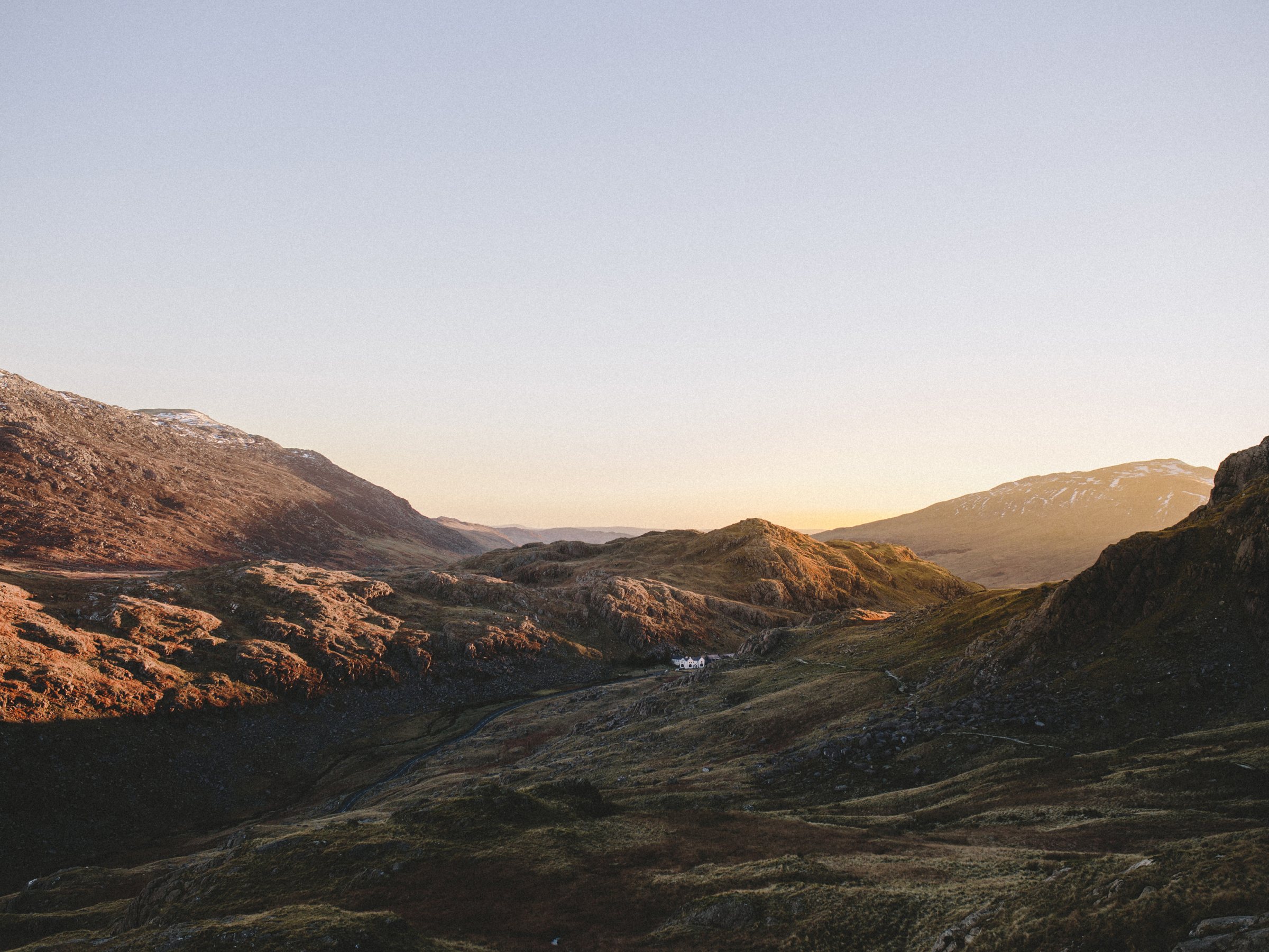Golden hour over the mountains of Eryri, snow lying on the higher tops